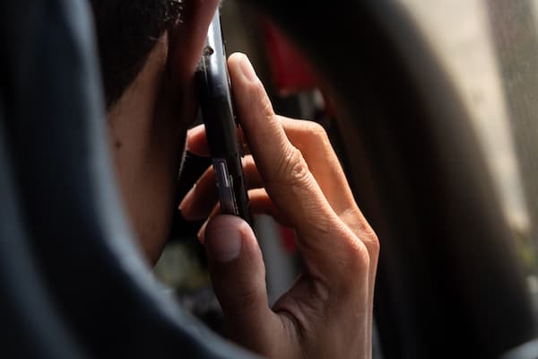 Person Holding Phone To Ear